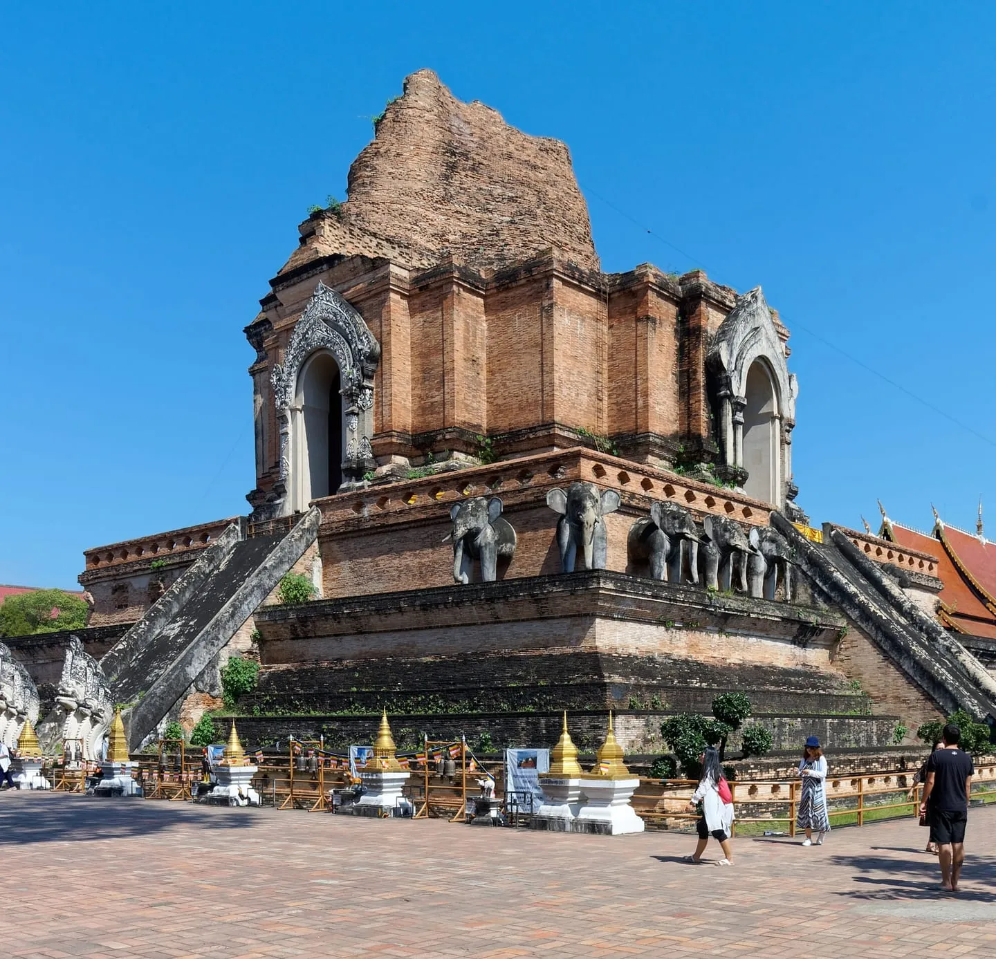 The ruined brick chedi of Wat Chedi Luang in Chiang Mai under a blue sky
